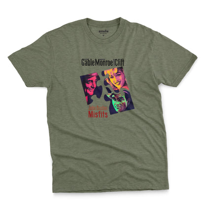 A green t-shirt featuring a colorful graphic advertisement for the movie The Misfits starring Clark Gable, Marilyn Monroe, and Montgomery Clift.